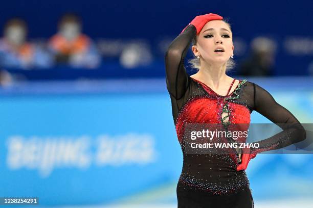 Russia's Kamila Valieva reacts after competing in the women's single skating free skating of the figure skating team event during the Beijing 2022...