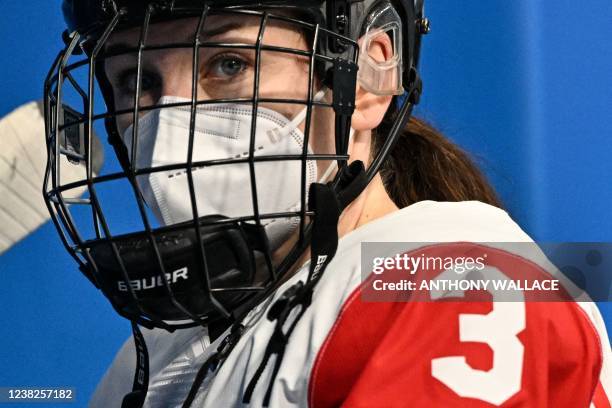 Canada's Jocelyne Larocque reacts during the women's preliminary round group A match of the Beijing 2022 Winter Olympic Games ice hockey competition...