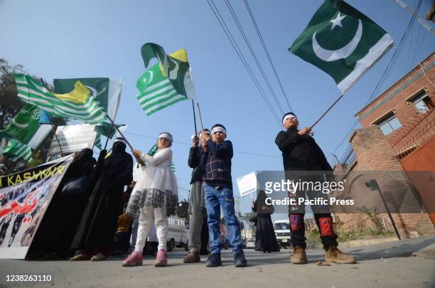 Supporters of the Pakistani religious party Jamaat-e-Islami rally in support for Indian Kashmiris in Peshawar. Pakistan will observe the Kashmir Day...