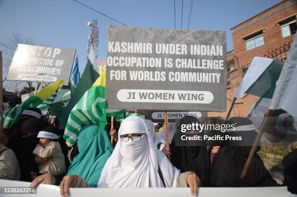 Supporters of the Pakistani religious party Jamaat-e-Islami rally in support for Indian Kashmiris in Peshawar. Pakistan will observe the Kashmir Day...