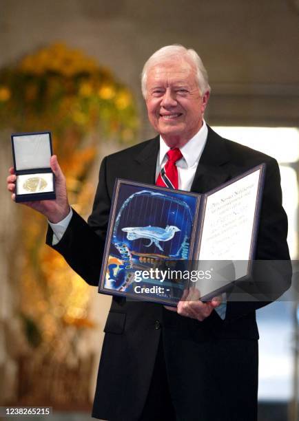Former US president Jimmy Carter smiles after receiving the 2002 Nobel Peace Prize during a ceremony in the Oslo City Hall 10 December 2002.