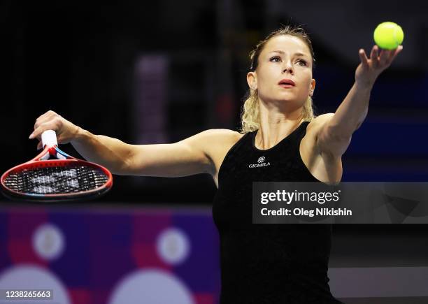 Camila Giorgi of Italy plays a shot against Ekaterina Alexandrova of Russia during on Day One of the WTA St. Petersburg Ladies Trophy at Sibur Arena...