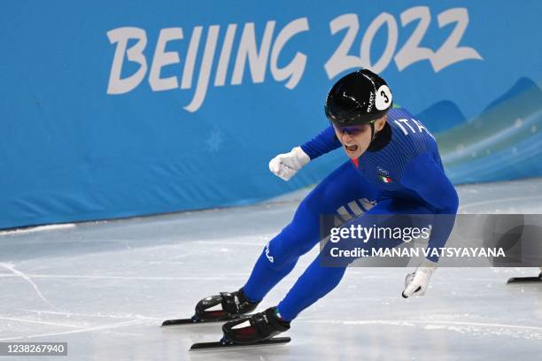 Italy's Arianna Fontana celebrates winning the final A of the women's 500m short track speed skating event during the Beijing 2022 Winter Olympic...