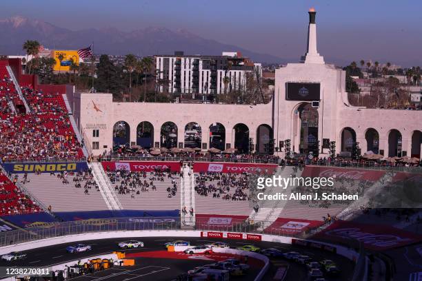 Los Angeles, CA With a view of the snow-capped mountains in the background, NASCAR racers circle the quarter-mile track during the Busch Light Clash...