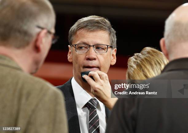 Presenter Guenther Jauch receives make-up prior to a photocall to promote his new ARD show GUENTHER JAUCH at Gasometer on September 5, 2011 in...