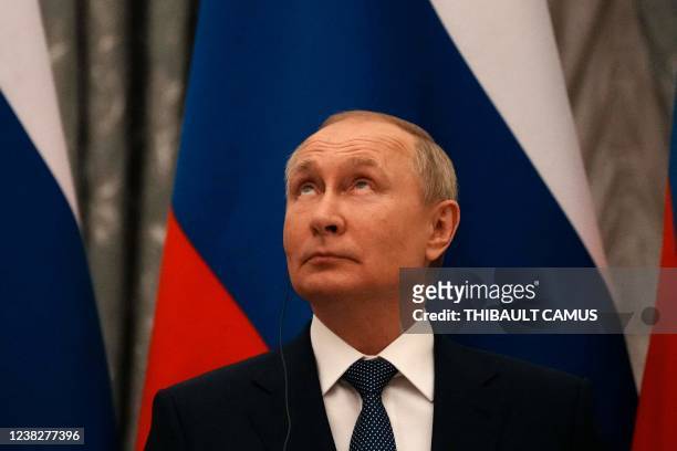 Russian President Vladimir Putin looks on during a press conference after meeting with French President in Moscow, on February 7, 2022. -...