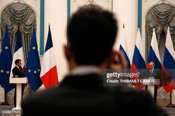 Russian President Vladimir Putin and French President Emmanuel Macron give a joint press conference after meeting in Moscow, on February 7, 2022. -...