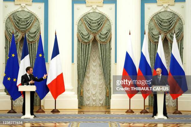 Russian President Vladimir Putin listens during a joint press conference with French President Emmanuel Macron in Moscow, on February 7, 2022. -...