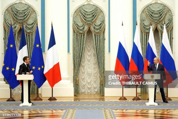 Russian President Vladimir Putin gestures during a joint press conference with French President Emmanuel Macron in Moscow, on February 7, 2022. -...
