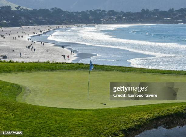 The 9th hole green in front of a panoramic view of the beach along the course at the Final Round of the AT&T Pebble Beach Pro-Am tournament at Pebble...