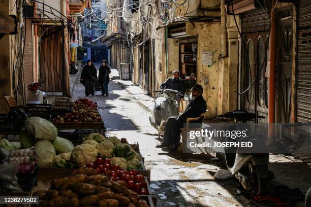 Vegetable vendor displays his fresh produce in an alley in the northern Lebanese city of Tripoli's empoverished neighbourhood of Bab al-Tabbaneh, on...