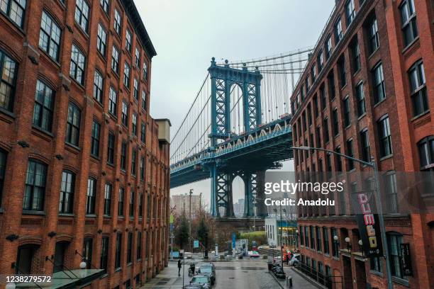 Manhattan Bridge is seen from the Dumbo neighborhood of Brooklyn during foggy weather in New York City, United States on February 7, 2022.