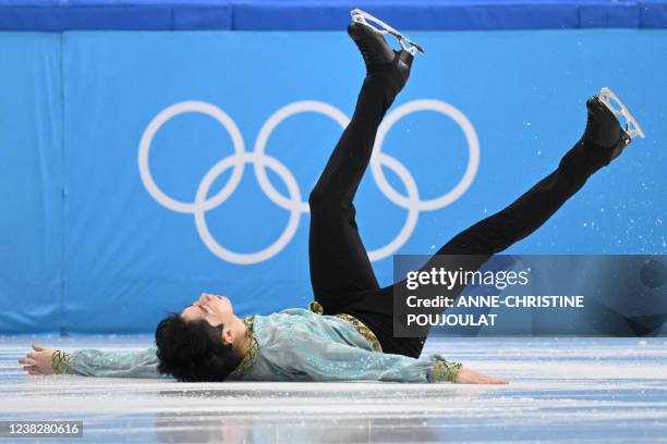 South Korea's Lee Si-hyeong falls as he competes in the men's single skating short program of the figure skating event during the Beijing 2022 Winter...