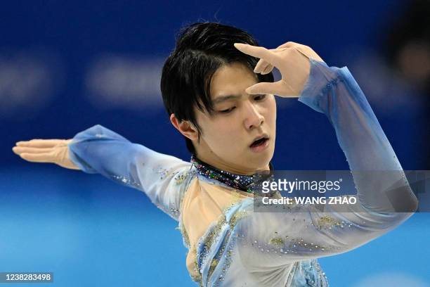 Japan's Yuzuru Hanyu competes in the men's single skating short program of the figure skating event during the Beijing 2022 Winter Olympic Games at...