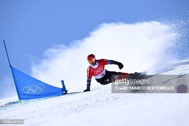 Slovenia's Zan Kosir competes in the snowboard men's parallel giant slalom elimination run during the Beijing 2022 Winter Olympic Games at the...