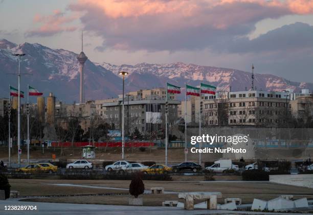 Vehicles travel in Azadi square in western Tehran which is decorated with Iran flags to mark the 43rd anniversary of Victory of Irans 1979 Islamic...