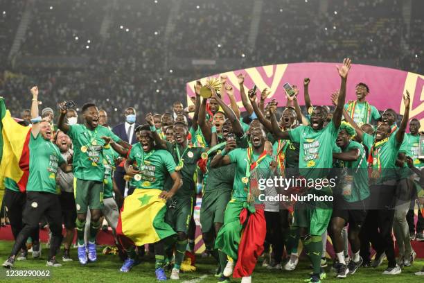 Senegal players celebrate with the trophy after winning the 2021 Africa Cup of Nations final soccer match against Egypt at the Paul Biya 'Olembe'...