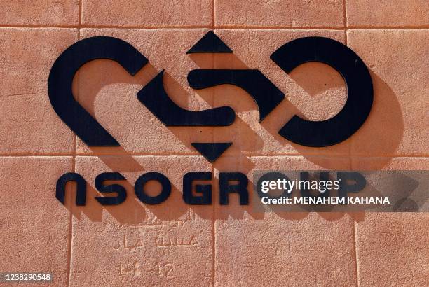 The NSO Group company logo is displayed on a wall of a building next to one of their branches in the southern Israeli Arava valley near Sapir...