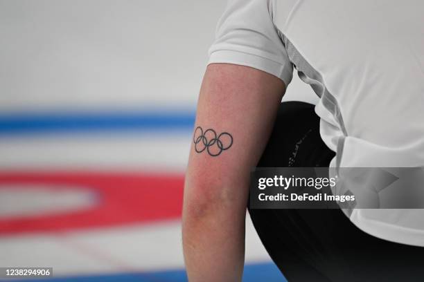 The olympic rings at the arm of Magnus Negrotten of Norway at the Mixed Doubles Gold Medal Game Results - Olympic Curling - Italy vs Norway during...