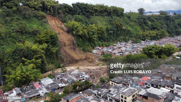 Aerial view of a landslide caused by heavy rains in Pereira, Risaralda department, Colombia, on February 8, 2022. - The landslide left 7 dead and 29...
