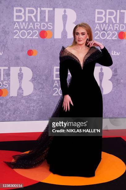 British singer Adele Laurie Blue Adkins aka Adele poses on the red carpet upon her arrival for the BRIT Awards 2022 in London on February 8, 2022. -...