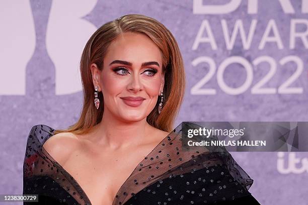 British singer Adele Laurie Blue Adkins aka Adele poses on the red carpet upon her arrival for the BRIT Awards 2022 in London on February 8, 2022. -...