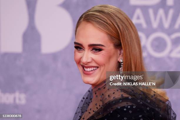 British singer Adele Laurie Blue Adkins aka Adele poses on the red carpet upon her arrival for the BRIT Awards 2022 in London on February 8, 2022. -...