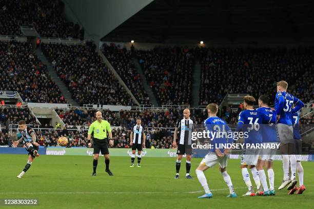 Newcastle United's English defender Kieran Trippier scores their third goal from this freekick during the English Premier League football match...