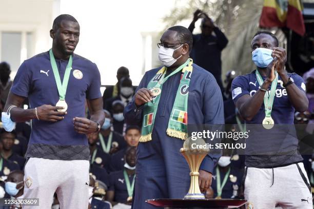 Senegal's President Macky Sall , Senegal's forward Sadio Mane and Senegal's defender Kalidou Koulibaly attend the decoration ceremony near the Palace...