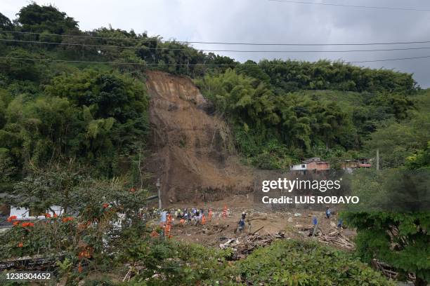 Aerial view of rescuers removing debris during the search of victims after a landslide caused by heavy rains in Pereira, Risaralda department,...