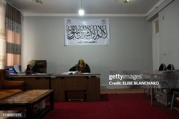 This picture taken on January 17, 2022 shows a female municipality employee, who has been able to continue working following the Taliban takeover, at...