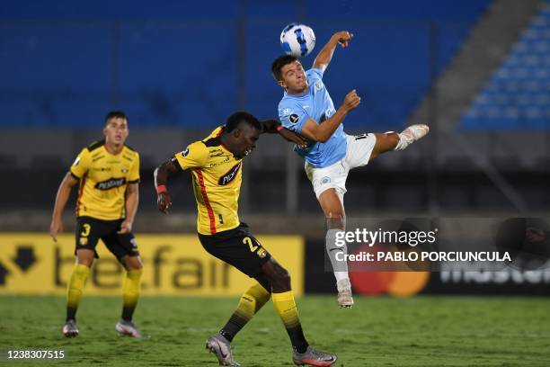 Ecuador's Barcelona Michael Carcelen and Uruguay's Montevideo City Torque Joaquin Zeballos vie for the ball during their Copa Libertadores football...