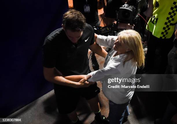 Juan Martin Del Potro cries in her mother's arms after losing a match against Federico Delbonis of Argentina at Buenos Aires Lawn Tennis Club on...