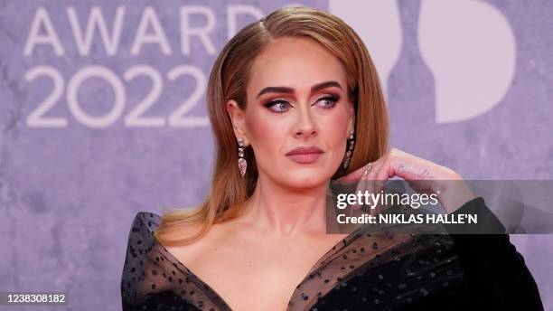 British singer Adele Laurie Blue Adkins aka Adele poses on the red carpet upon her arrival for the BRIT Awards 2022 in London on February 8, 2022. -...