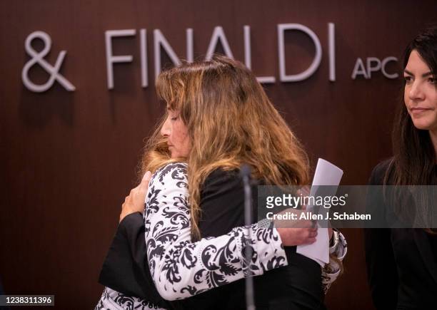 Irvine, CA Former UCLA gynecologist/oncologist James Heaps survivors Kara Cagle, left, hugs Julie Wallach, as Jane Reilley, right, associate...