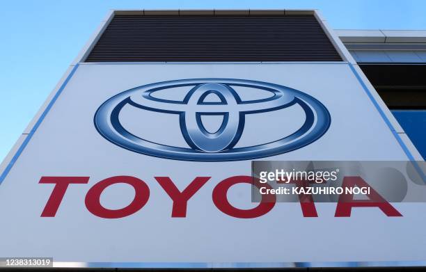 Sign for Japan's Toyota Motor is displayed at a dealership in Tokyo on February 9, 2022.