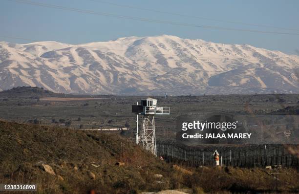 Watchtower stands near the Israeli border fence with Syria in the Israeli-annexed Golan Heights on February 9, 2022. - Israel launched strikes...