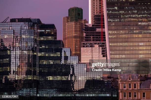 City of London skyline with 20 Fenchurch Street, affectionately nicknamed the Walkie Talkie reflecting the sun going down on 2nd February 2022 in...