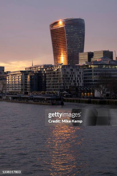 City of London skyline with 20 Fenchurch Street, affectionately nicknamed the Walkie Talkie reflecting the sun going down on 2nd February 2022 in...