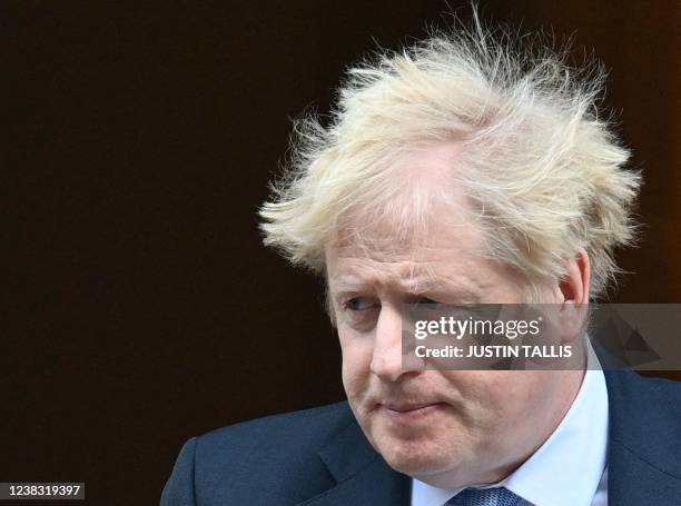 Britain's Prime Minister Boris Johnson leaves from 10 Downing Street in central London on February 9, 2022 to take part in the weekly session of...