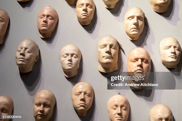 Prosthetic faces on a wall at Warner Bros studio tour, The Making of Harry Potter on the 27th of November 2021 in Watford, London, United Kingdom....