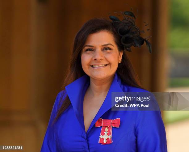 Actress Nina Wadia poses with her OBE following an investiture ceremony at Windsor Castle on February 9, 2022 in Windsor, England.