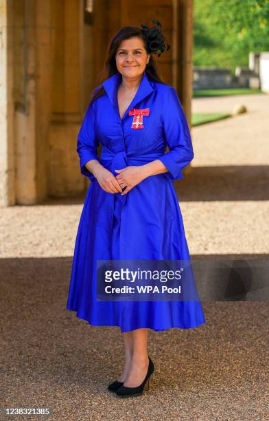 Actress Nina Wadia poses with her OBE following an investiture ceremony at Windsor Castle on February 9, 2022 in Windsor, England.