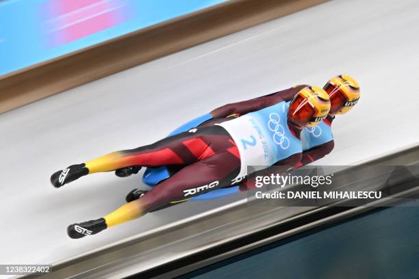 Germany's Toni Eggert and Sascha Benecken compete in the final run of the luge doubles event at the Yanqing National Sliding Centre during the...