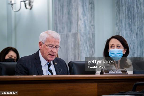 As Chairwoman Maria Cantwell looks on Ranking Member Roger Wicker questions Gigi Sohn as she testifies during a Senate Commerce, Science, and...