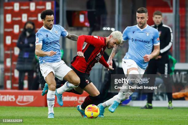 Felipe Anderson of SS Lazio, Theo Hernandez of AC Milan and Sergej Milinkovic-Savic of SS Lazio battle for the ball during the Coppa Italia match...