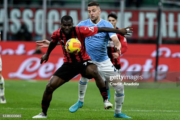 Franck Kessie of AC Milan in action against Sergej Milinkovic-Savic of Lazio during the Coppa Italia match between AC Milan vs Lazio at San Siro...