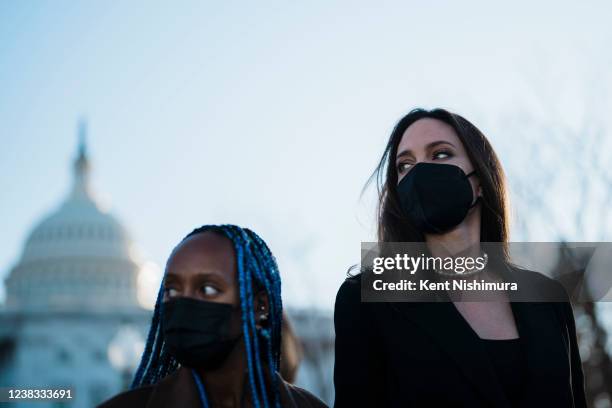 Actress Angelina Jolie, right, walks with her daughter Zahara Jolie-Pitt, left, leave the U.S. Capitol after Jolie spoke at a news conference on the...