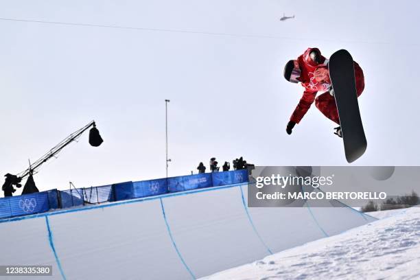 Canada's Elizabeth Hosking competes in the snowboard women's halfpipe final run during the Beijing 2022 Winter Olympic Games at the Genting Snow Park...