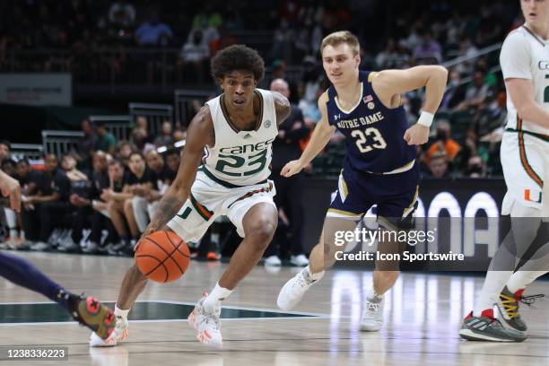 Miami Hurricanes guard Kameron McGusty drives to the basket as Notre Dame Fighting Irish guard Dane Goodwin trail in defense during the game between...